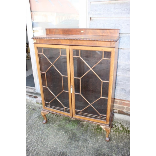 548 - A carved mahogany display cabinet enclosed lattice glazed doors, on cabriole supports, 36