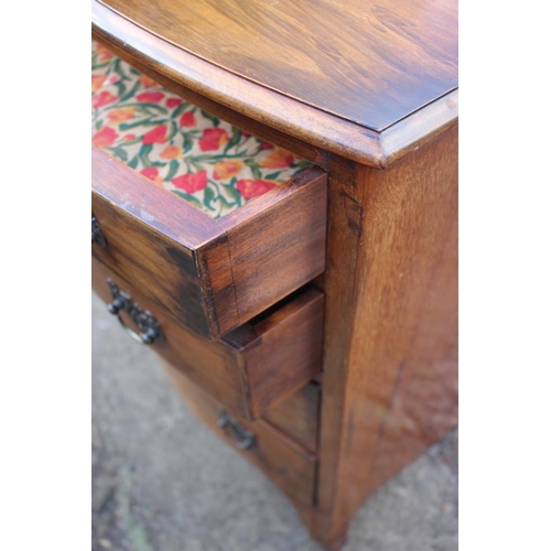 550 - A walnut bowfront chest of four long drawers, on splay bracket supports, 22 1/2