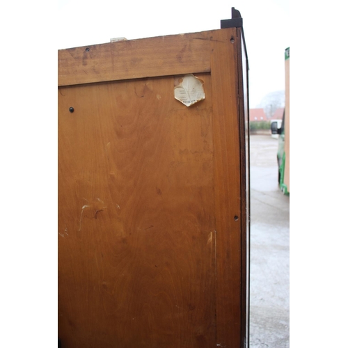 557 - An early 20th century mahogany Compactum wardrobe, Model YCH with fully fitted interior enclosed two... 