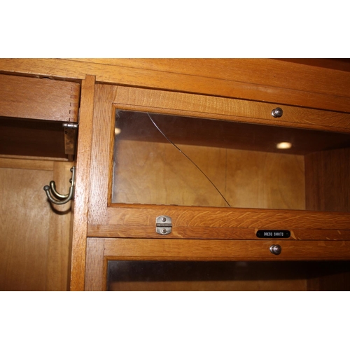 557 - An early 20th century mahogany Compactum wardrobe, Model YCH with fully fitted interior enclosed two... 