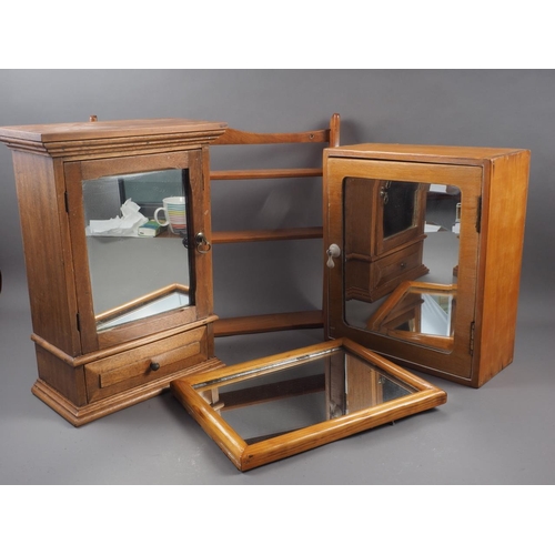 558 - Two pine bathroom cabinets enclosed mirror doors, a pine framed wall mirror, plate 8