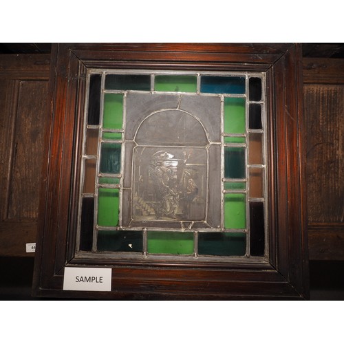 274 - An early 20th century back lit stained glass and leaded window Annunciation, in stained pine frame, ... 