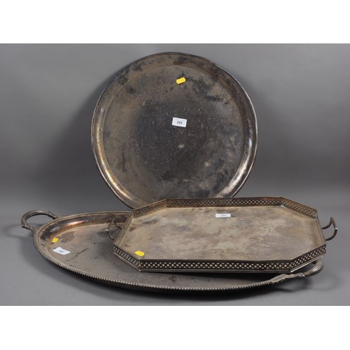 295 - A silver plated two-handled tray, a plated gallery tray, two plated circular trays and two brass cir... 