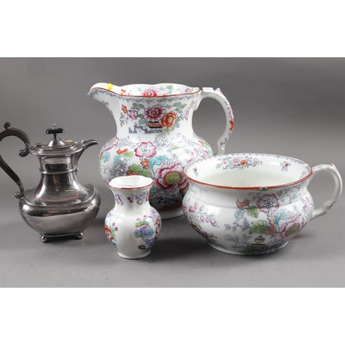 58 - A 19th century floral decorated toilet jug, a companion chamber pot and toothbrush vase, and a silve... 