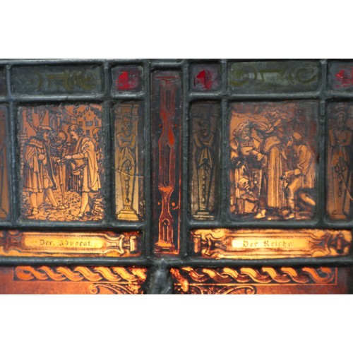 273 - An early 20th century back lit stained glass and lead window,  four panels from dance of death in st... 