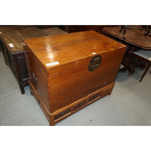 556 - A Chinese softwood coffer chest, on stand fitted four drawers, 40