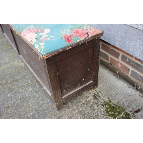 570 - A long oak window seat with lift up lid, covered in a floral fabric worn, 91