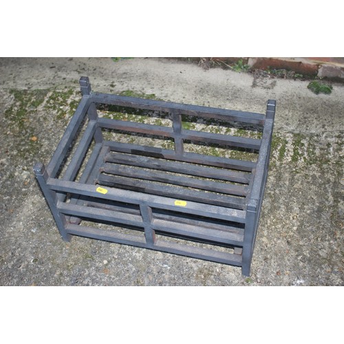 573 - A cast iron fire basket, 19