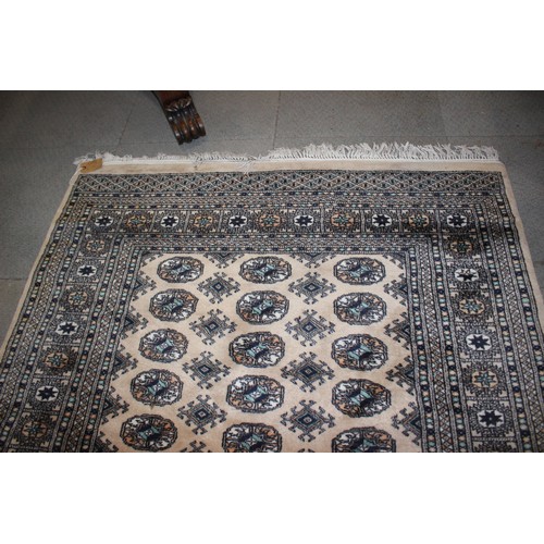 582 - A Bokhara rug of traditional design with thirty-six central elephant guls and multi-bordered in shad... 