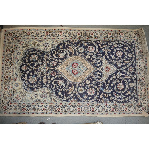 585 - A Persian prayer rug with all-over scroll design on a blue and cream ground, 44