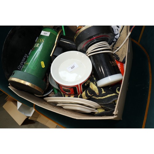 227 - A quantity of Guinness ceramic and glass ashtrays, beer pumps, bar mats, etc