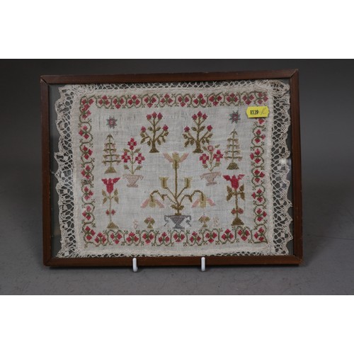 197 - An early 19th century floral sampler with crochet edge, 8 1/2