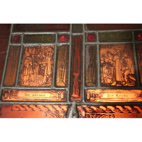 273 - An early 20th century back lit stained glass and lead window,  four panels from dance of death in st... 