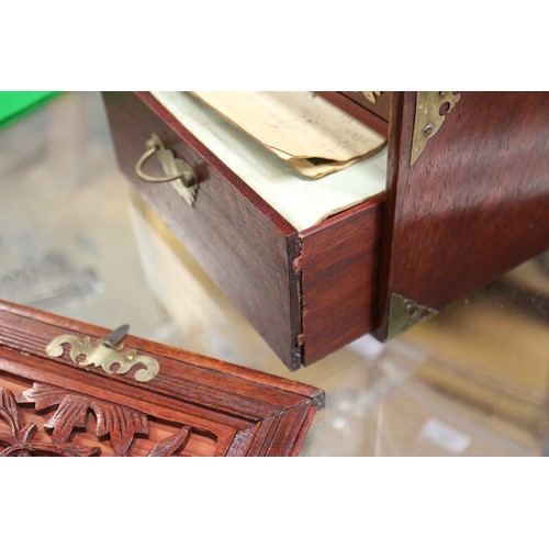 194 - A Mah-jongg set with bone and bamboo counters, in a hardwood and brass mounted box