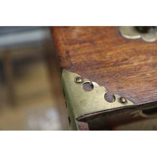 194 - A Mah-jongg set with bone and bamboo counters, in a hardwood and brass mounted box