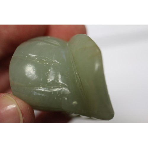 122 - A Chinese pale jade roundel with pierced and engraved decoration, 2 1/4