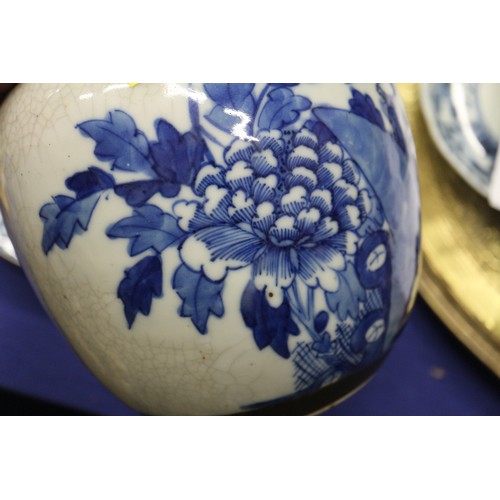 111 - A Chinese blue and white crackle glazed ginger jar with floral decoration, and associated carved har... 