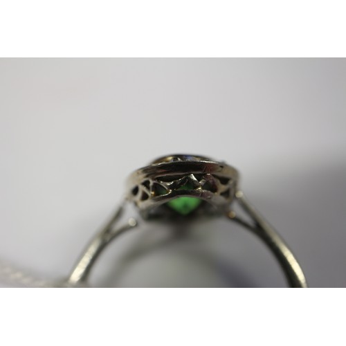 358 - A white metal ring, set demantoid garnet, 2ct approx, and rose diamond collar