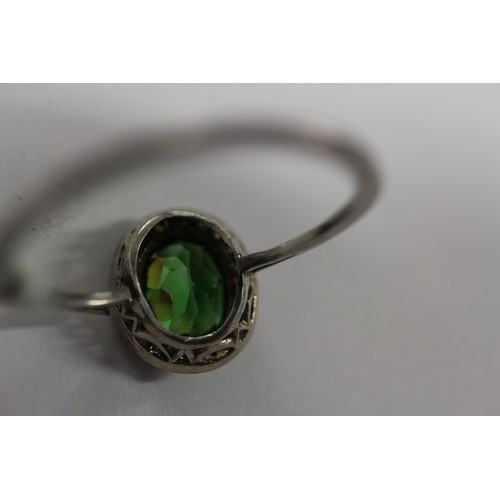 358 - A white metal ring, set demantoid garnet, 2ct approx, and rose diamond collar