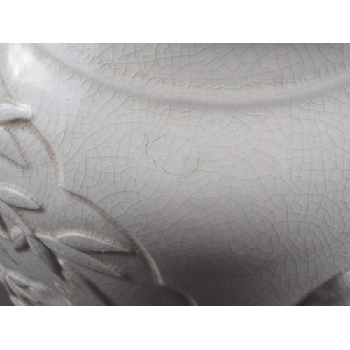 100 - A Chinese blanc de chine vase with relief panels decorated with birds, trees and animals, 13