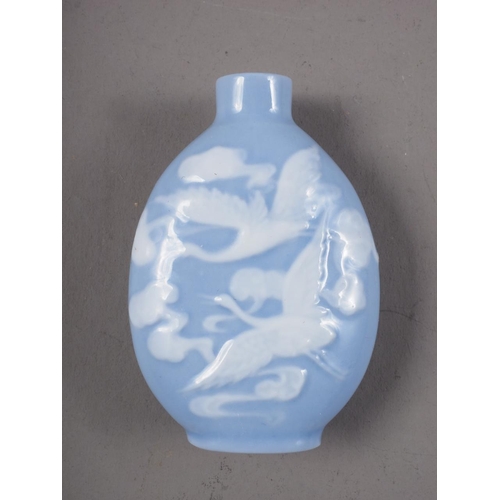 103 - A Chinese blue and white pate sur-pate-snuff bottle with relief crane decoration, 2