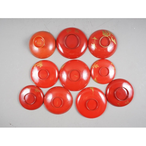 107 - Ten 19th century Japanese red lacquer shallow dishes, some signed