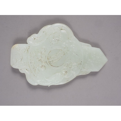 116 - A Chinese jade roundel with carved dragon decoration, on stand, 6