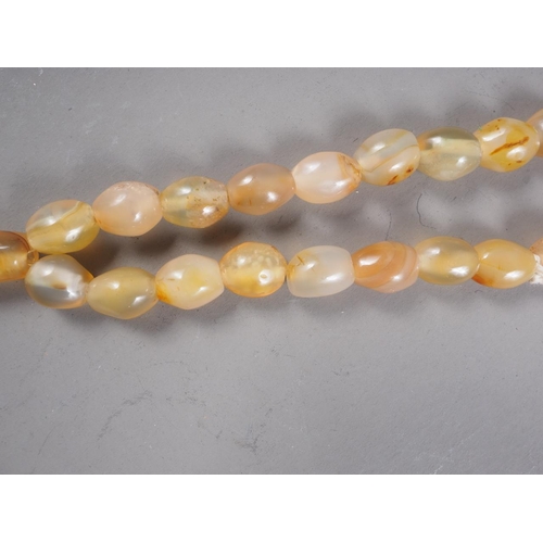 118 - A set of  agate prayer beads with gold coloured wiring