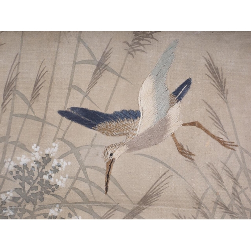 122 - A Japanese watercolour scroll with embroidered storks, 24 3/4