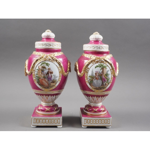 14 - A pair of 19th century Berlin oviform swag decorated vases and covers with figured reserves, on squa... 