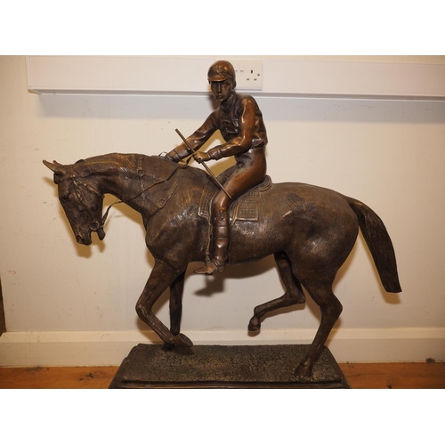 146 - A bronze model of horse and jockey, on marble base, 37 1/2