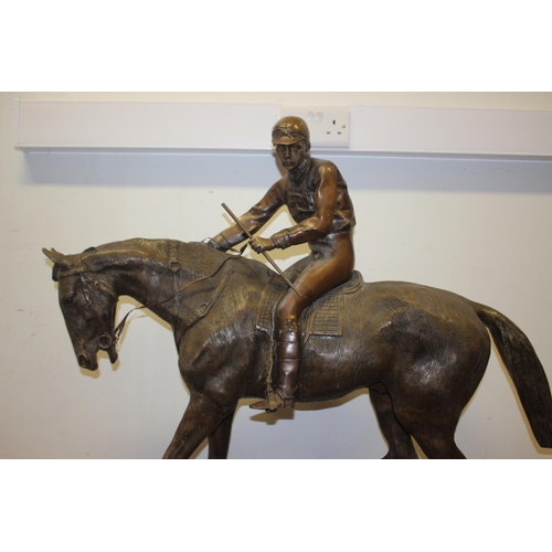 146 - A bronze model of horse and jockey, on marble base, 37 1/2