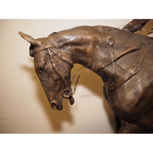 146 - A bronze model of horse and jockey, on marble base, 37 1/2