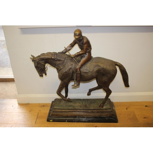 146 - A bronze model of horse and jockey, on marble base, 37 1/2