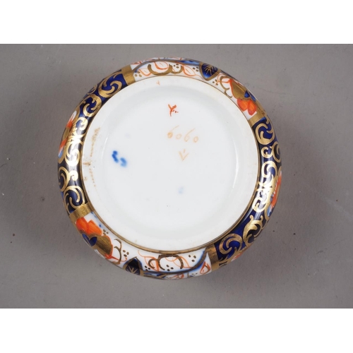 15 - A Royal Crown Derby bone china Imari octagonal box and cover, 4 1/2