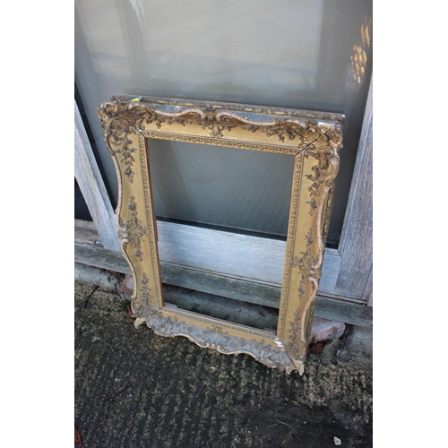 158 - An ornate gilt picture frame, 31