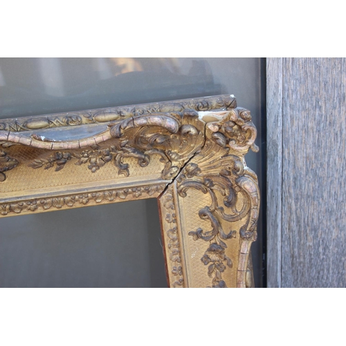 158 - An ornate gilt picture frame, 31