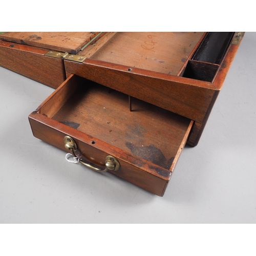 159 - A mahogany and brass bound writing slope, 12