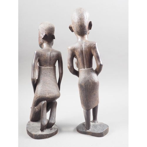 162 - Two African carved ebony figures of women, taller 14