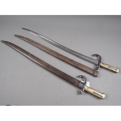 204 - Two 19th century French chassepot bayonets, in metal scabbards, 28