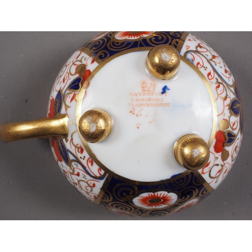 22 - A Davenport Imari decorated cabinet cup and saucer, an early 19th century trio and a Kakiemon style ... 