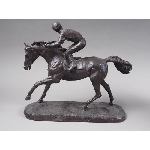 232 - A patinated composition model of a rearing horse, 22 1/2