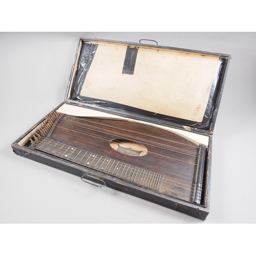 242 - An Austrian zither with original purchase receipt from 1900, in case (damages to case)