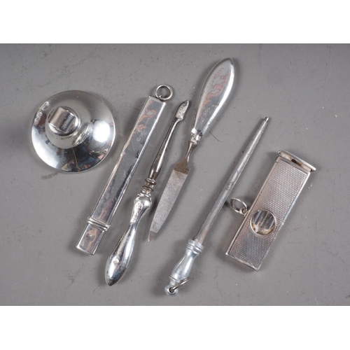 309 - A silver cigar cutter, a silver mounted pencil, two silver mounted manicure pieces and a silver stan... 