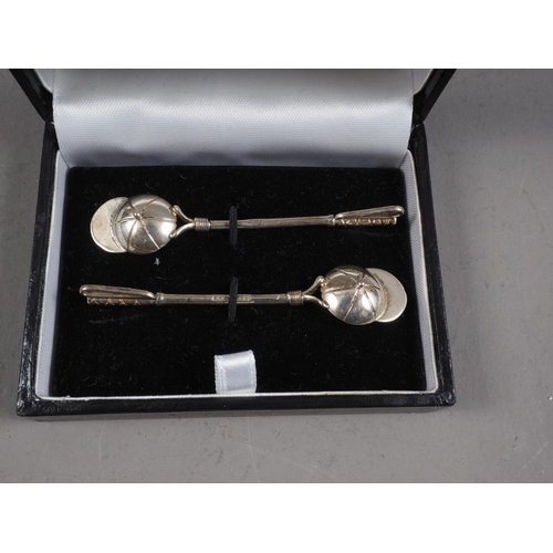 311 - A pair of silver jockey cap and riding crop salt spoons, in case