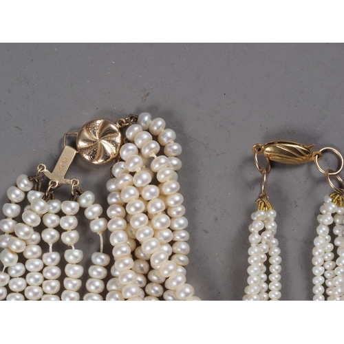 329 - A pearl multi-strand necklace with 14ct gold clasp and another similar with 9ct gold clasp