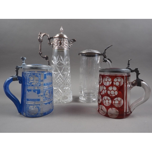 33 - An Austrian 19th century blue overlaid and engraved tankard, a similar ruby overlaid and cut tankard... 