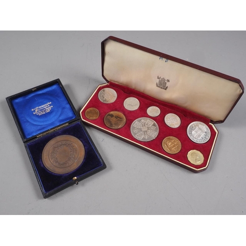 347 - A cased 1953 Great Britain coin set and a cased bronze Midwifery medallion