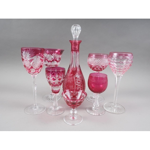 35 - Five ruby glass and cut wines, three smaller similar glasses, a decanter and stopper