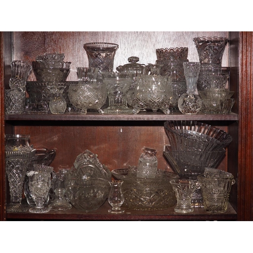 53 - A collection of mostly clear pressed glass, including bowls, vases, drinking glasses, jugs and other... 